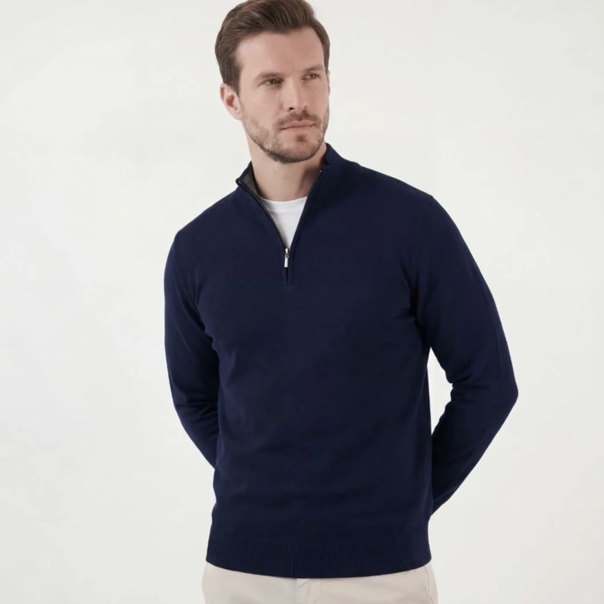 Studio photograph of a model wearing the same navy quarter-zip, generated by StoreFactory